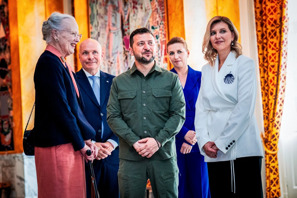 Queen Margrethe II of Denmark, left, speaks with Ukrainian President Volodymyr Zelenskyy, center, and his wife First Lady Olena Zelenska, right