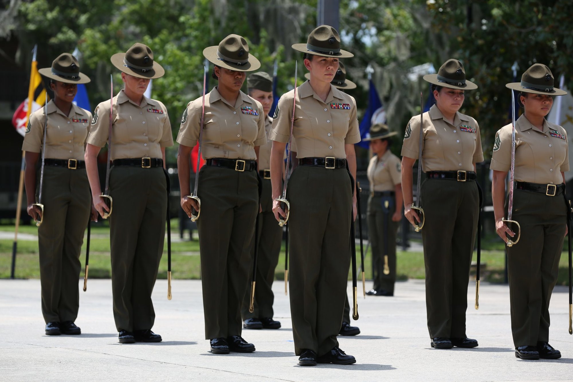 U.S. Marines with 4th Recruit Training Battalion, Recruit Training Regiment, Marine Corps Recruit Depot Parris Island, stand at the position of attention during the 4th Battalion relief and appointment ceremony aboard Marine Corps Recruit Depot Parris Island, S.C., July 18, 2014. The relief and appointment ceremony represents the transfer of responsibility, authority and accountability from the outgoing sergeant major to the incoming sergeant major. (U.S. Marine Corps photo by Lance Cpl. Allison Lotz MCRD Parris Island Combat Camera/Released)