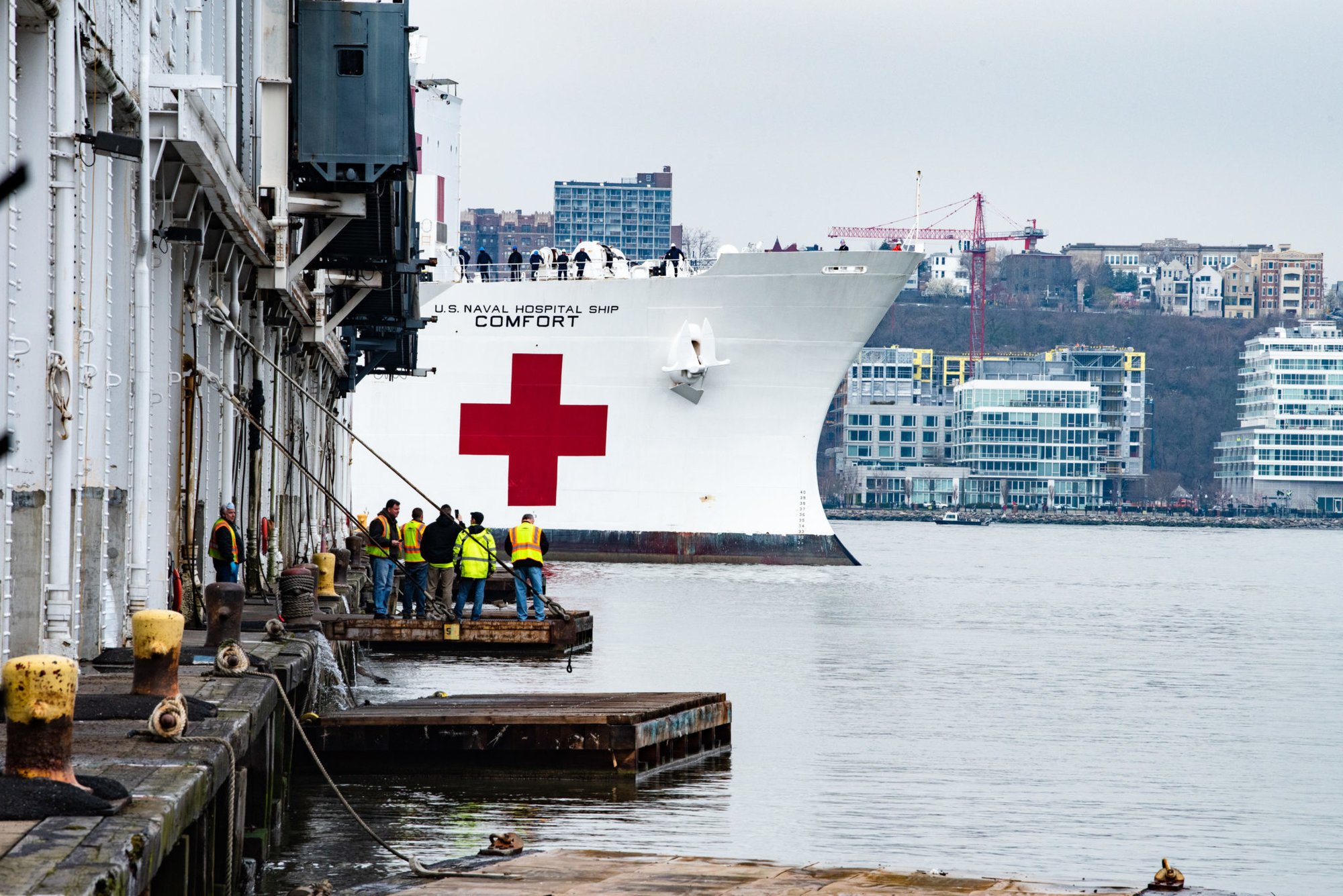 The USNS Comfort arrives in New York Harbor March 30, 2020, to support the national, state, and local response to the coronavirus (COVID-19). The hospital ship will provide approximately 1,000 beds for urgent care patients not infected with the virus, relieving pressure on local hospital systems. Photo by K.C. Wilsey/FEMA, via the Department of Defense.