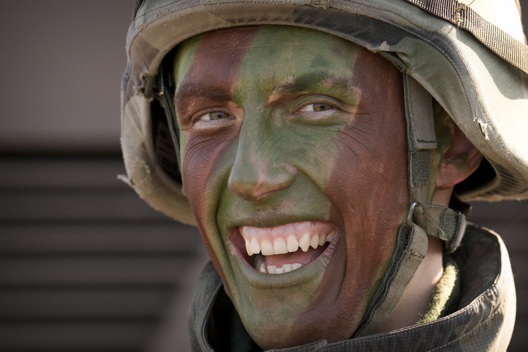A French serviceman laughs during a joint French US exercise involving HIMARS and MLRP rocket launchers at a firing range in Capu Midia, on the Black Sea shore, Romania, Thursday, Feb. 9, 2023. U.S. and French troops that are part of a NATO battlegroup in Romania held a military exercise on Thursday to test the 30-nation alliance's eastern flank defenses, as Russia's full-scale invasion of neighboring Ukraine nears its one-year anniversary. (AP Photo/Vadim Ghirda)