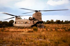 Soldiers from the 3rd Special Forces Group load a CH-47 Chinook assigned to the 82nd Combat Aviation Brigade following partnered training with the 82nd Combat Aviation Brigade, Fort Bragg, N.C., Sept. 8, 2015. The training gave the Soldiers the opportunity to call in air support, practice medical evacuation, and engaging targets with mortars. On Friday, June 2, 2023, the U.S. Army changed Fort Bragg to Fort Liberty as part of a broader initiative to remove Confederate names from bases. US Army photo by Staff Sgt. Christopher Freeman/82nd CAB PAO.