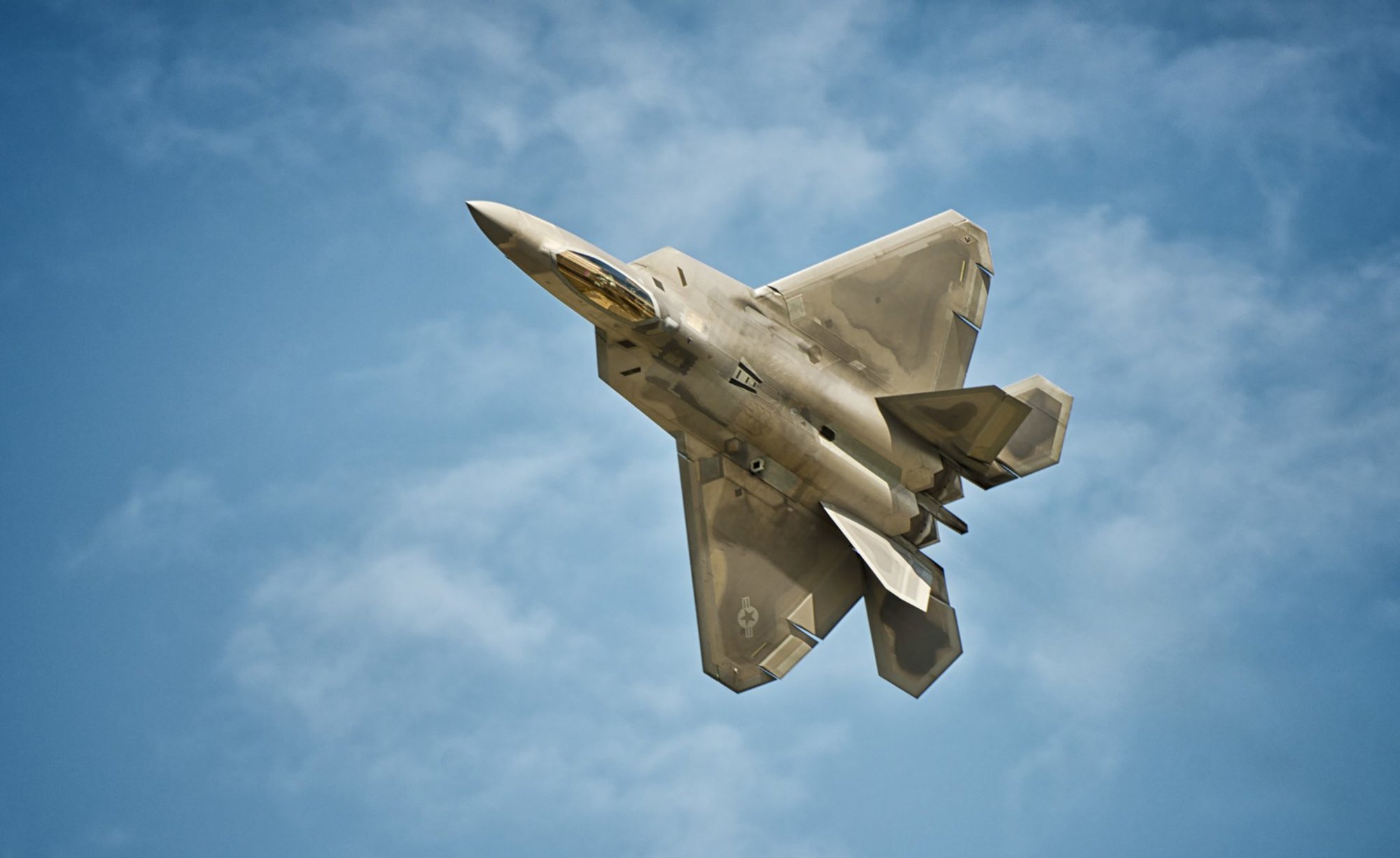 An F-22 Raptor demonstrates its warfighting capabilities during an F-22 demonstration at the biennial Arctic Thunder Open House on Joint Base Elmendorf-Richardson, Alaska, July 26, 2014. The event features more than 40 Air Force, Army and civilian aerial acts, July 25-27, and has an expected crowd of more than 200,000 people. It is the largest two-day event in the state and one of the premier aerial demonstrations in the world. The 2014 Arctic Thunder Open House is a proud part of the Anchorage Centennial Celebration.