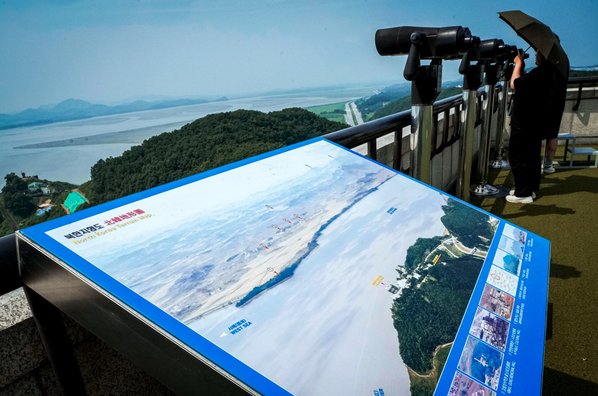 A visitor watches the North Korea side from the Unification Observation Post in Paju, South Korea.