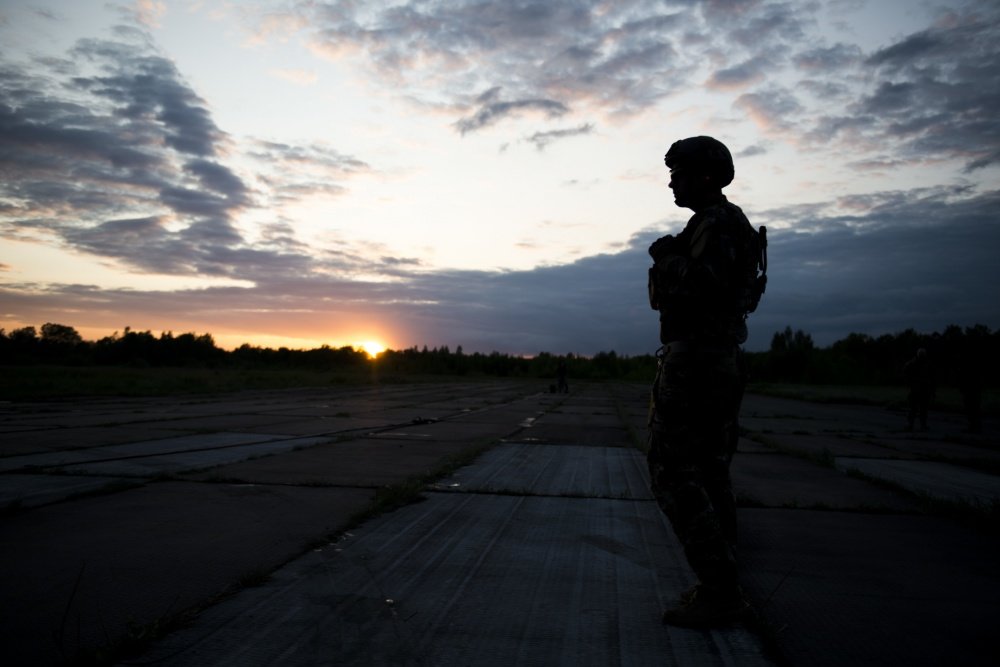 A Deployed Aircraft Ground Response Element team member assigned to the 352d Special Operations Support Squadron stands guard during a Forward Area Refueling Point training as part of TROJAN FOOTPRINT 16 in Pajuostic, Lithuania, May 15, 2016. Photo by 1st Lt. Christopher Sullivan via DVIDS.