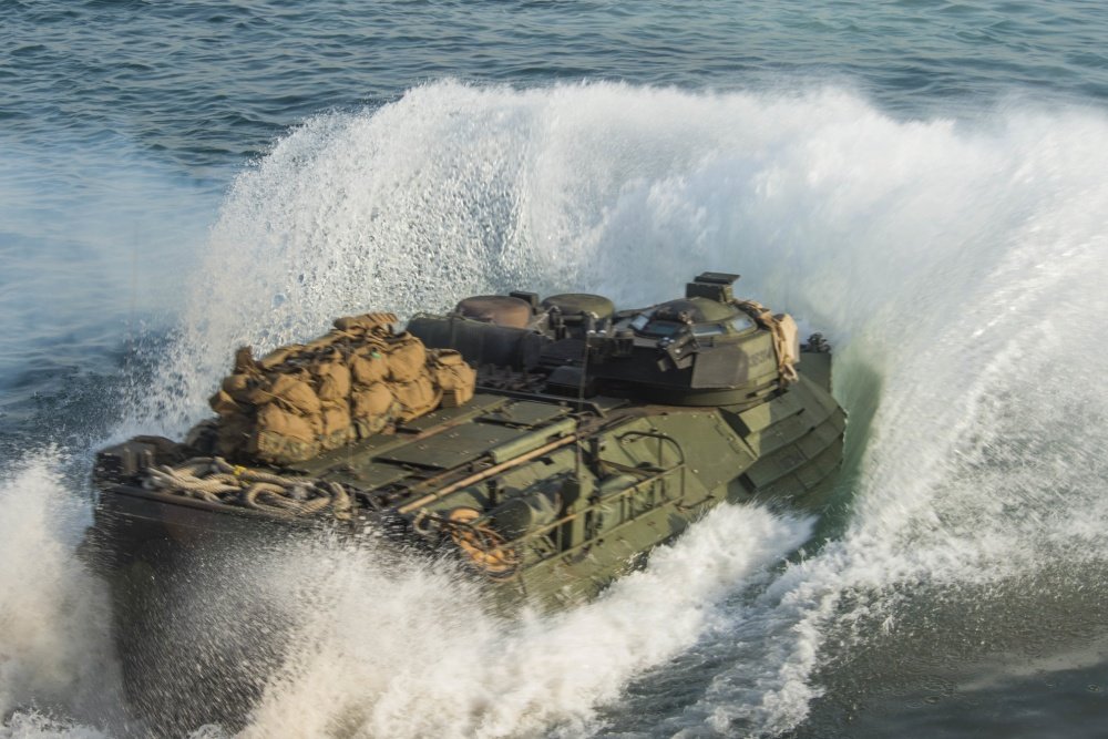 An amphibious assault vehicle departs from the well deck of Whidbey Island-class dock landing ship USS Rushmore. Navy photo by Mass Communication Specialist 3rd Class Chelsea Troy Milburn/Released.