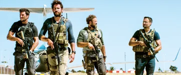 Left to Right: Pablo Schreiber plays Kris “Tanto” Paronto, John Krasinski plays Jack Silva, David Denman plays Dave “Boon” Benton and Dominic Fumusa plays John “Tig” Tiegen in 13 Hours: The Secret Soldiers of Benghazi from Paramount Pictures and 3 Arts Entertainment / Bay Films in theatres January 15, 2016.