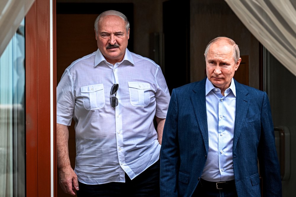 Russian President Vladimir Putin, right, and Belarusian President Alexander Lukashenko walk during their meeting at the Bocharov Ruchei residence in the resort city of Sochi, Russia.