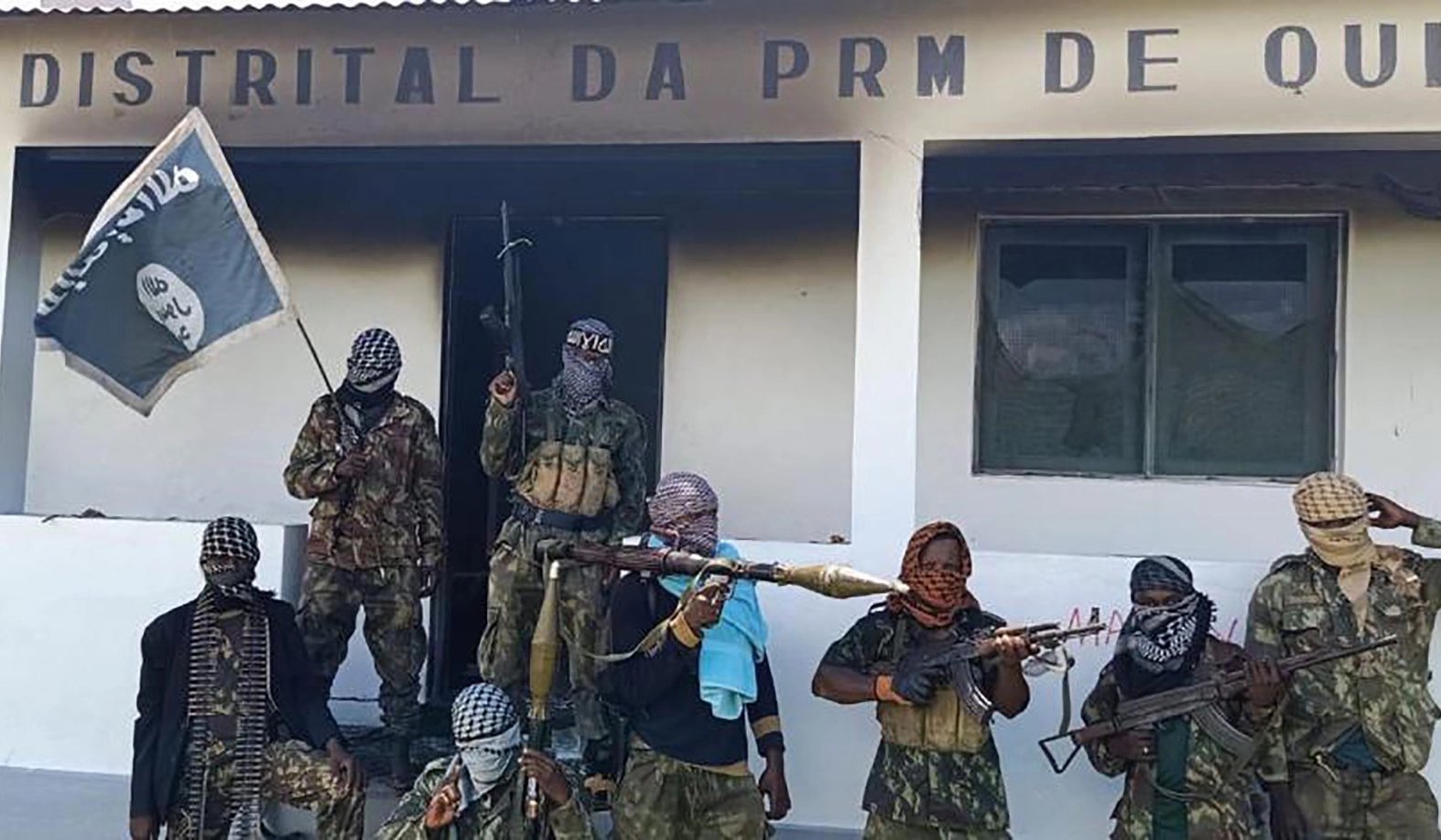 Militants carrying the ISIS flag in Mozambique’s northern province of Cabo Delgado. Photo via Defense News of Nigeria on Twitter.