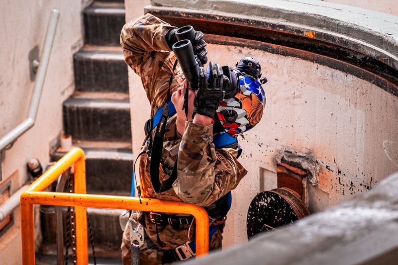 Senior Airman Marco Roberto, 741st Maintenance Squadron mechanical and pneudraulics team chief, uses binoculars to check the inside of a Transport Erector Replacement Program (TERP) vehicle.