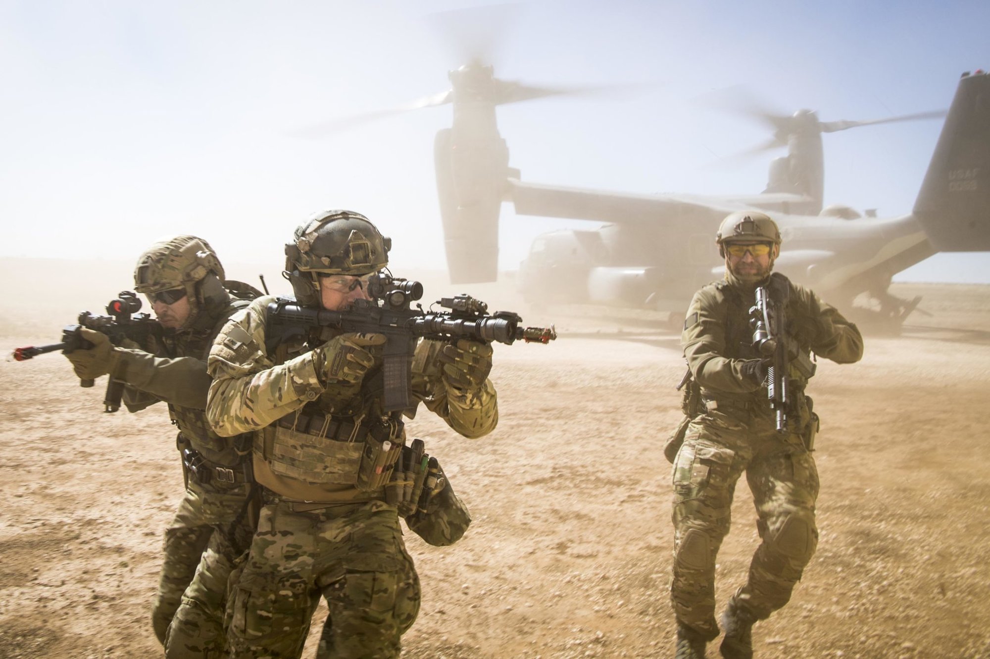 A joint special forces team move together out of a U.S. Air Force CV-22 Osprey Feb. 26, 2018, at Melrose Training Range, New Mexico. At Emerald Warrior, the largest joint and combined special operations exercise, U.S. Special Operations Command forces train to respond to various threats across the spectrum of conflict. (U.S. Air Force photo/Senior Airman Clayton Cupit)