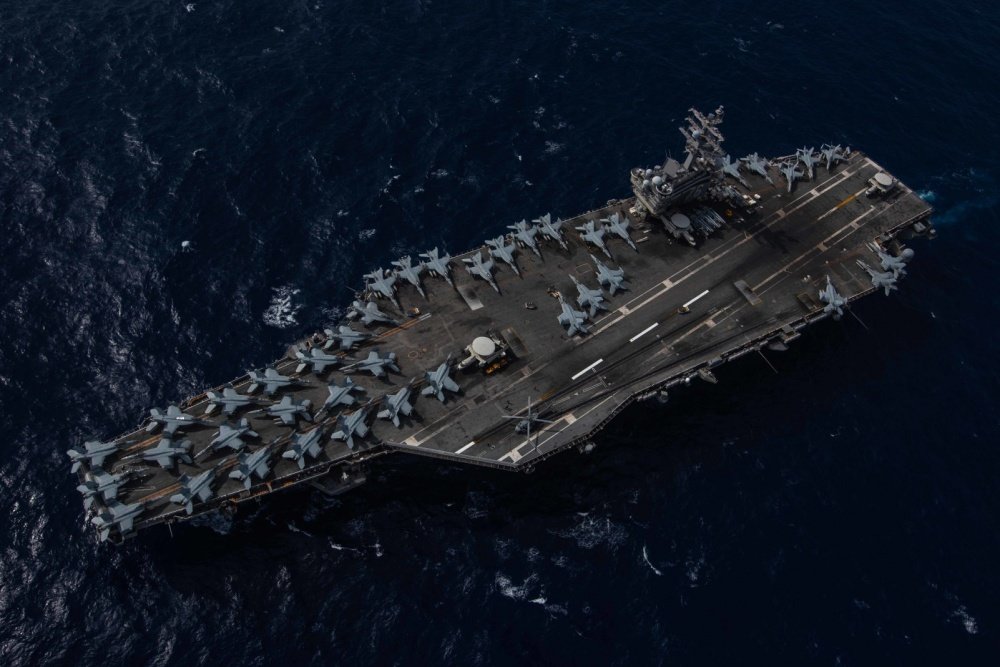 The Navy’s forward-deployed aircraft carrier USS Ronald Reagan (CVN 76) sails while underway. Ronald Reagan, the flagship of Carrier Strike Group 5, provides a combat-ready force that protects and defends the collective maritime interests of its allies and partners in the Indo-Pacific region. U.S. Navy photo by Mass Communication Specialist 2nd Class Kaila V. Peters.