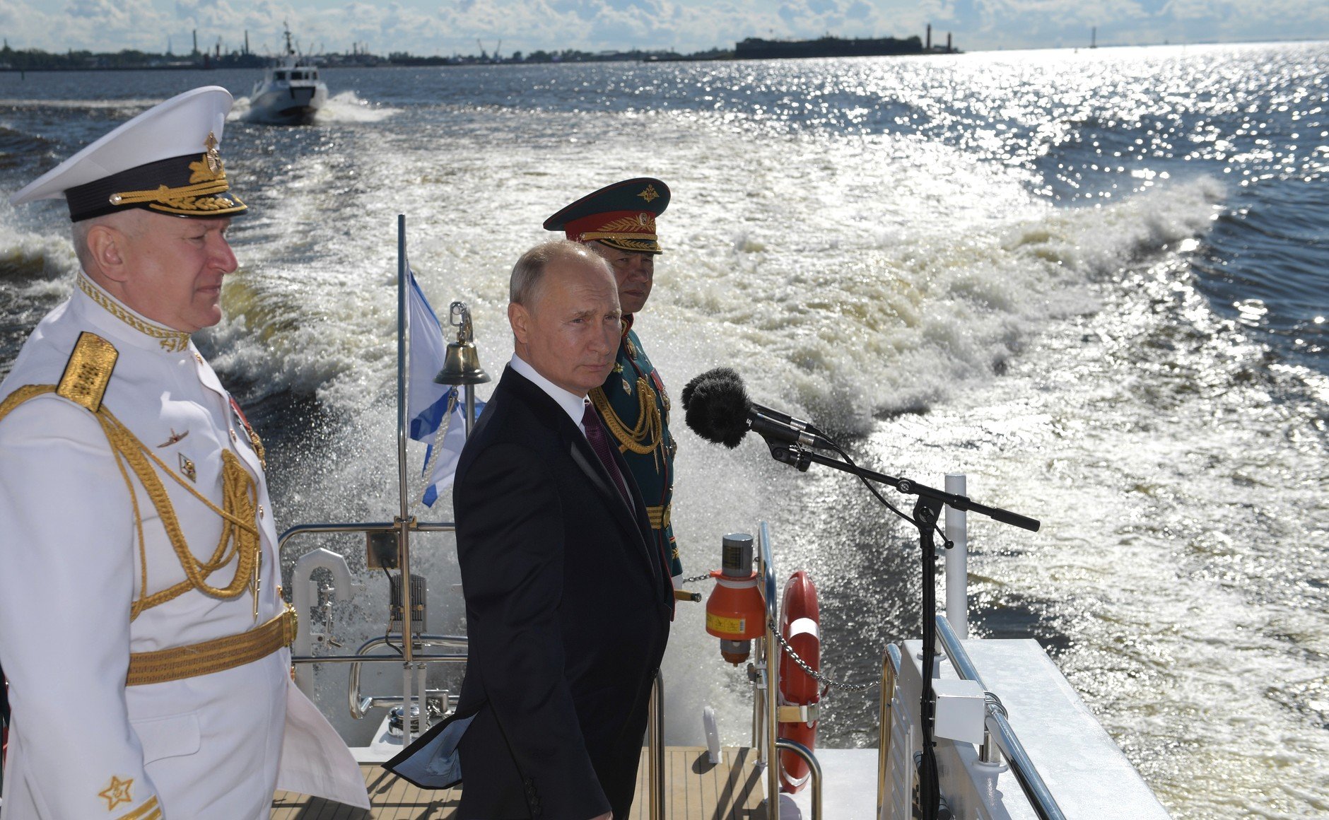 Russian President Vladimir Putin from a cutter reviewed Russian fleet formations during the Main Naval Parade on July 26, 2020. With Defence Minister Sergei Shoigu (right) and Commander-in-Chief of the Russian Navy Nikolai Evmenov. Photo courtesy of President of Russia website.