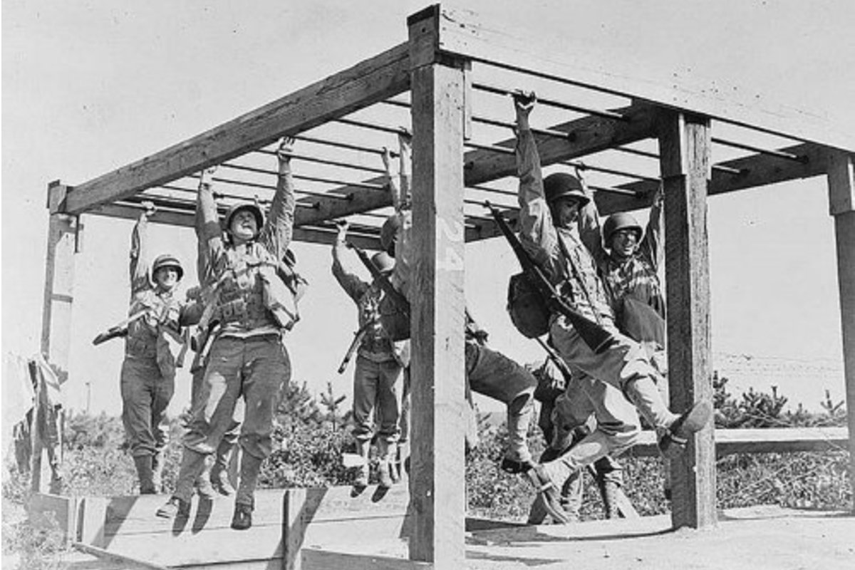 Enlisted men train on an obstacle course during World War II. Photo courtesy of the Library of Congress.