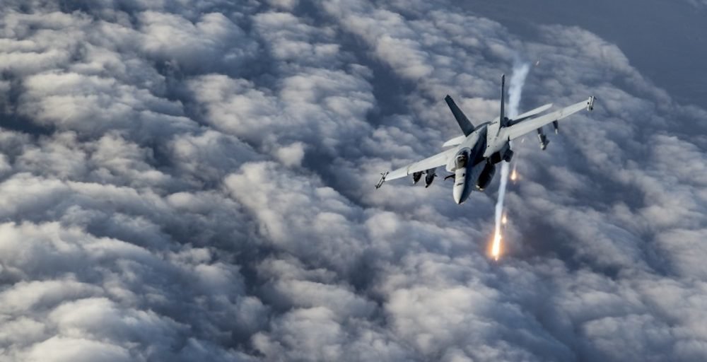 A U.S. Navy F/A-18E Super Hornet releases flares over Afghanistan, Jan. 23, 2020. The F/A-18E is the Navy’s primary strike and air superiority aircraft providing force projection, interdiction, and close and deep air support. U.S. Air Force photo by Staff Sgt. Matthew Lotz via DVIDS.