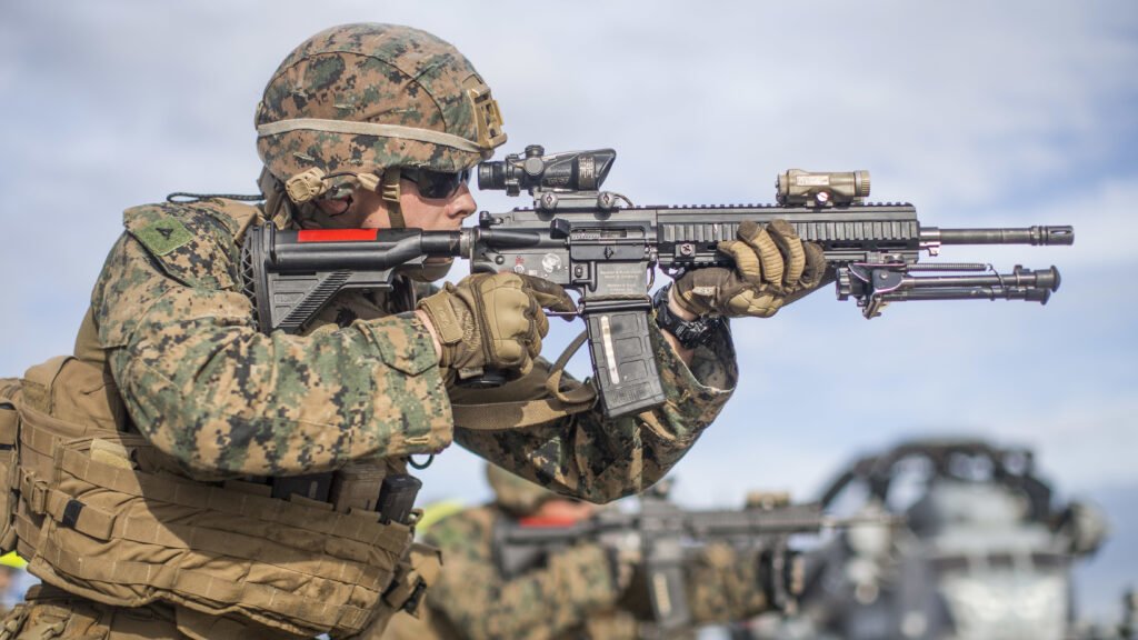 U.S. Marine Corps Lance Cpl. Logan Campbell, a rifleman with Lima Company, Battalion Landing Team 3/5, 11th Marine Expeditionary Unit (MEU), fires an M27 Infantry Automatic Rifle during a live-fire range aboard the amphibious assault ship USS Boxer (LHD 4). Photo by Cpl. Dalton S. Swanbeck/U.S. Marine Corps, Released.