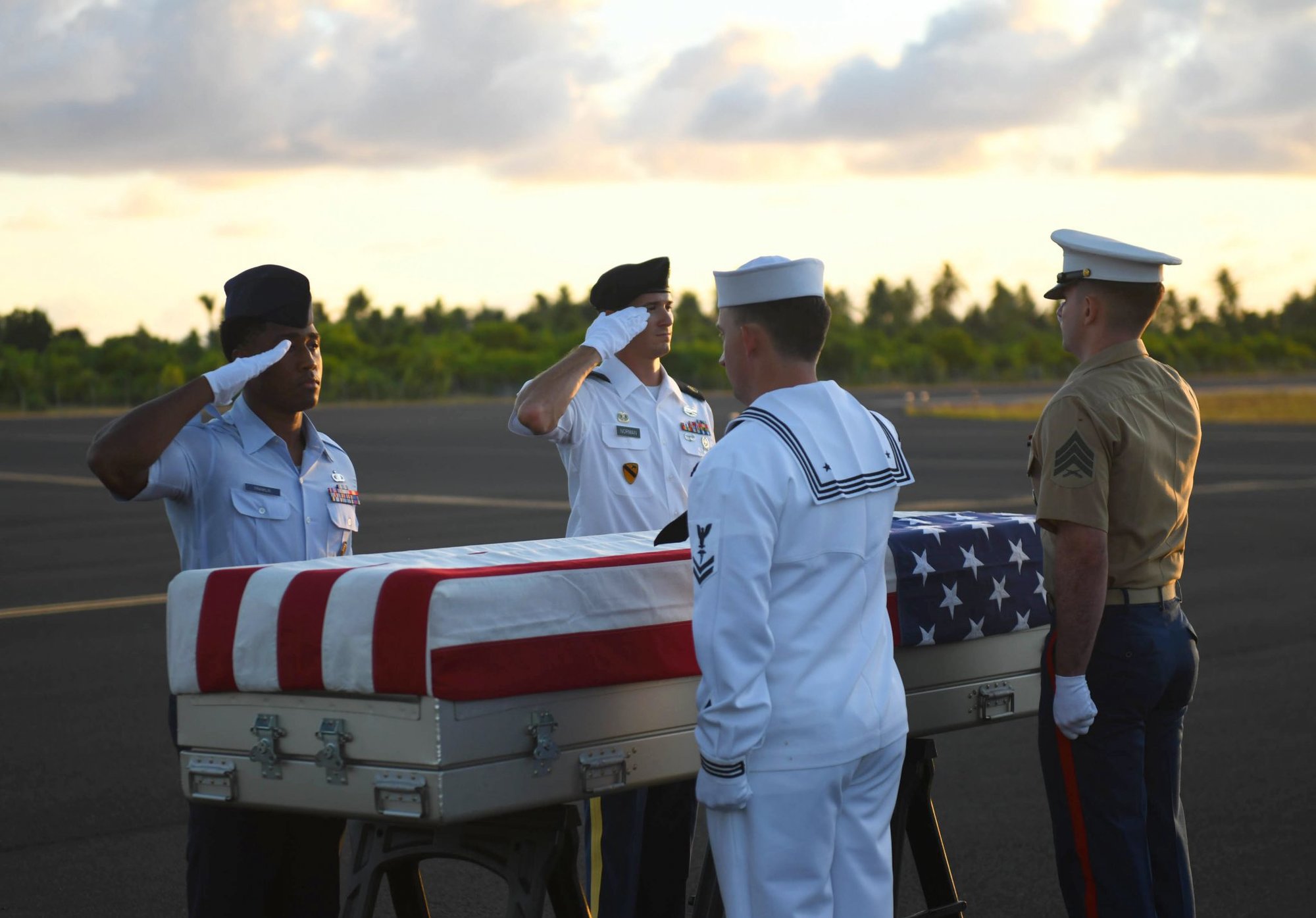 Joint service members assigned to the Defense POW/MIA Accounting Agency (DPAA), render honors during a repatriation ceremony in Tarawa, Republic of Kiribati Sept. 28, 2019. DPAA, in cooperation with History Flight, Inc., repatriated 12 sets of remains believed to be those of American service members who went missing in WWII. DPAA’s mission is to provide the fullest possible accounting of our missing personnel to their families and the nation. (U.S. Navy photo by Mass Communication Specialist 1st Class Amara Timberlake)