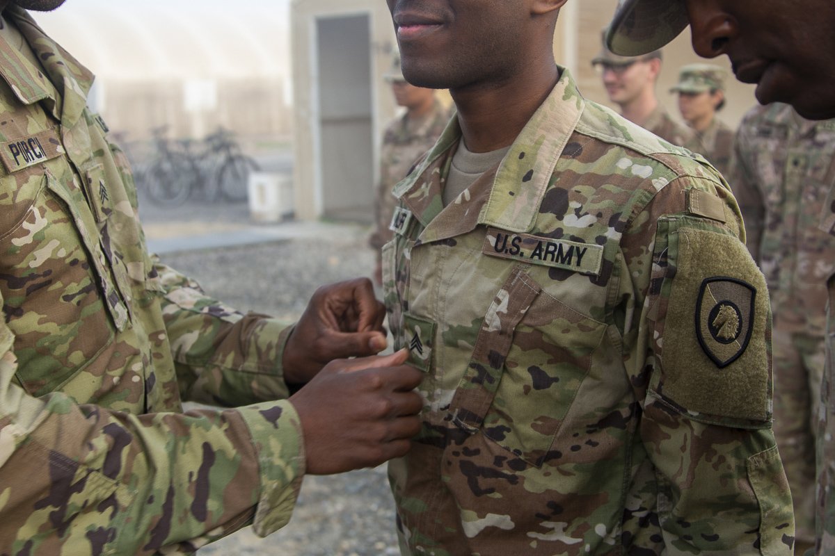 Spc. Andrew Miller, Medic, with the 300th Special Troops Battalion, 300th Sustainment Brigade, is promoted to Sgt. Andrew Miller on Dec. 01, 2018, Camp Arifjan, Kuwait. (U.S. Army Reserve Photo by Capt. Jerry Duong)