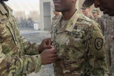 Spc. Andrew Miller, Medic, with the 300th Special Troops Battalion, 300th Sustainment Brigade, is promoted to Sgt. Andrew Miller on Dec. 01, 2018, Camp Arifjan, Kuwait. (U.S. Army Reserve Photo by Capt. Jerry Duong)