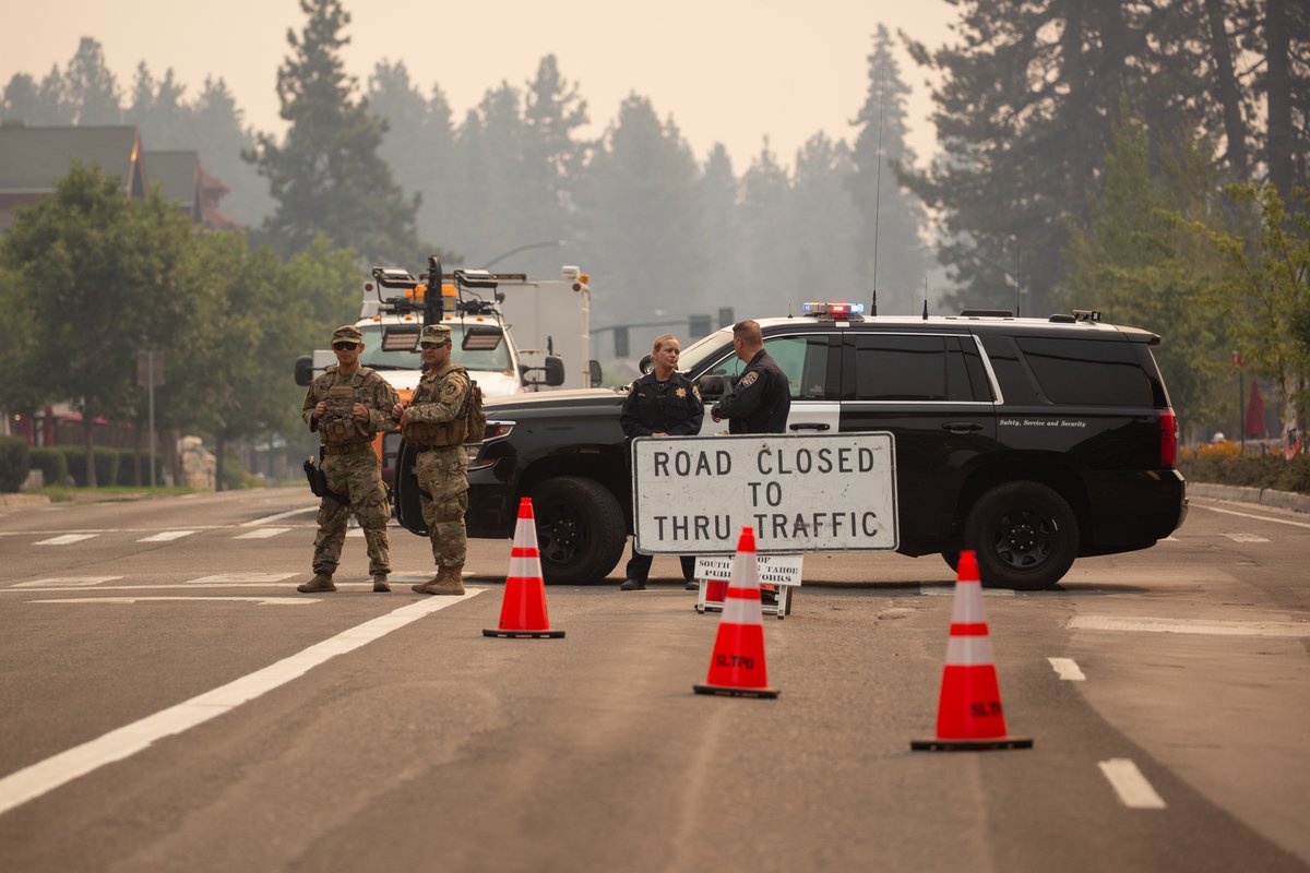 Spc. Raymundo Morales, left, and Staff Sgt. Jesus Valencia, second from the left, from the California Army National Guard’s 270th Military Police Company work a checkpoint along US Route 50 near South Lake Tahoe, California, Wednesday, Sept. 1, 2021. US Air National Guard photo by Staff Sgt. Crystal Housman.