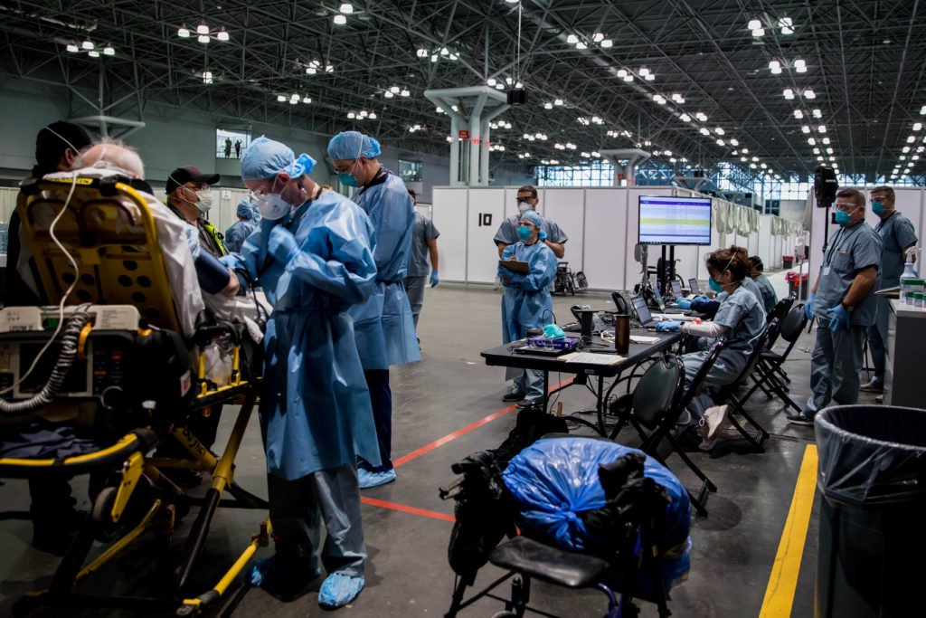 Army Spc. Daniel Fields takes a patient’s blood pressure reading in the Javits New York Medical Station in New York City, March 31, 2020. U.S. Navy photo by Chief Mass Communication Specialist Barry Riley/RELEASED.