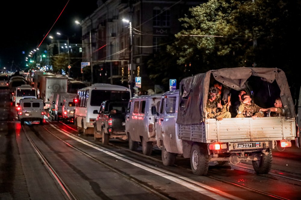 Servicemen of the Wagner Group military company sit in their military vehicles as they prepare to leave an area at the HQ of the Southern Military District.