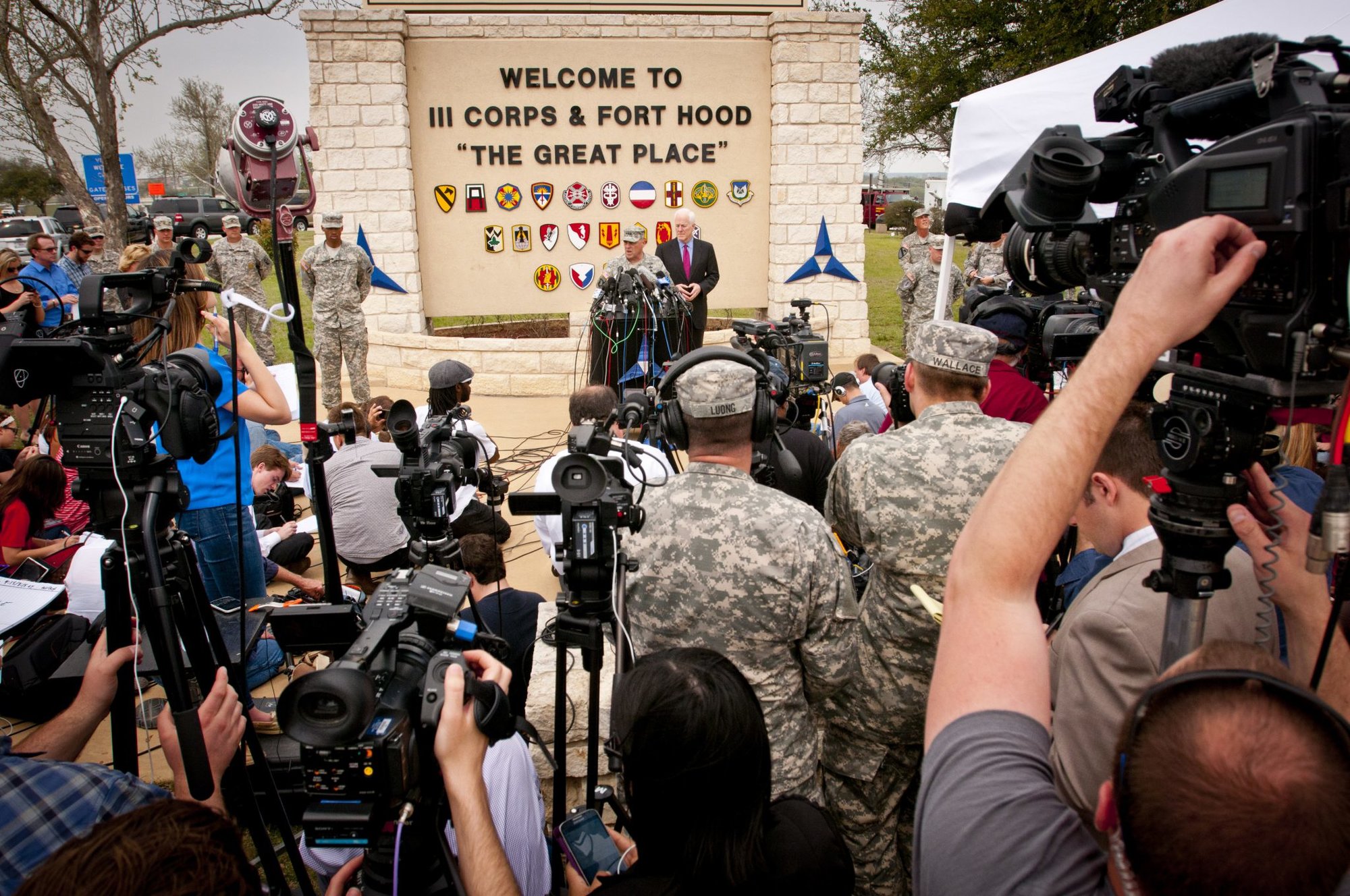 Lt. Gen. Mark Milley, III Corps and Fort Hood commanding general, and U.S. Senator John Cornyn take questions from reporters during a press conference outside the main gate at Fort Hood, Texas April 3. During the press conference, Milley identified the assailant in the April 2 shooting incident on the post as Spc. Ivan A. Lopez, 34, a truck driver with the 49th Transportation Movement Control Battalion, 13th Sustainment Command (Expeditionary). Sixteen people were injured and three killed in the shooting spree. Lopez took his own life following a confrontation with a military police officer. The senator offered condolences as well as his support to the Fort Hood community at the press conference. (U.S. Army photo by Sgt. Ken Scar, 7th Mobile Public Affairs Detachment)