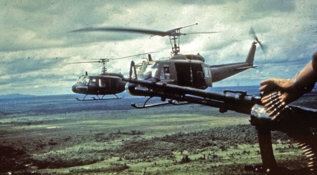 Bell UH-1 Iroquois (Huey) helicopters in flight over Vietnam, ca. late 1960s/early 1970s, Agent Orange