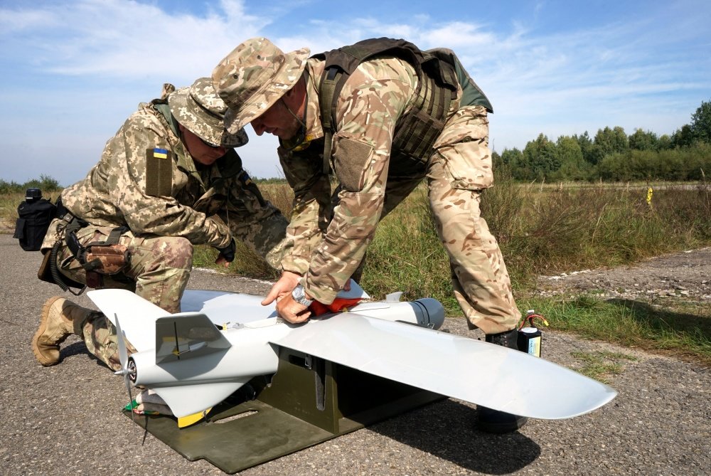 Ukrainian soldiers pack up a drone used for aerial observation during an Operational Capabilities Concept evaluation at the International Peacekeeping and Security Centre in Yavoriv, Ukraine, Sept. 11, 2018. US Army National Guard photo by Army Spc. Amy Carle.