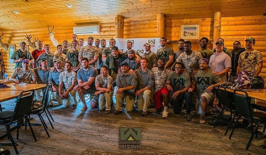 The Warrior Rising Team poses with the Minnesota Vikings. Photo courtesy of Jason Van Camp.