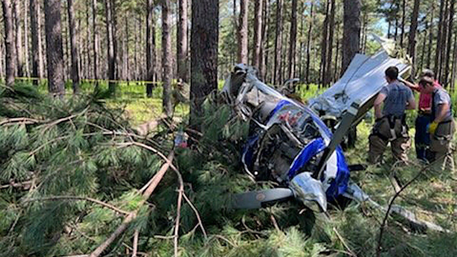 Members of the Jasper County Fire Rescue assess a plane crash four miles from Ridgeland-Claude Dean Airport in a wooded area. Jasper County Fire Rescue photo.