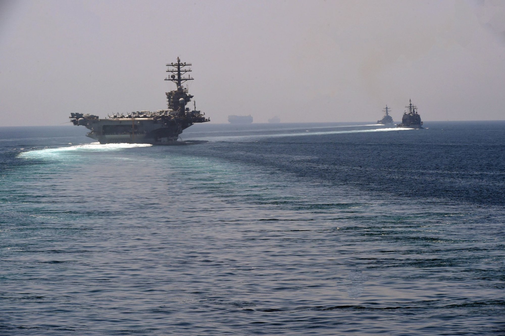 STRAIT OF HORMUZ (Sep. 18, 2020) The aircraft carrier USS Nimitz (CVN 68), guided-missile cruiser USS Princeton (CG 59) and guided-missile destroyer USS Sterett (DDG 104) steam in formation during a Strait of Hormuz transit, Sept. 18. U.S. Navy photo by Mass Communication Specialist 2nd Class Indra Beaufort.