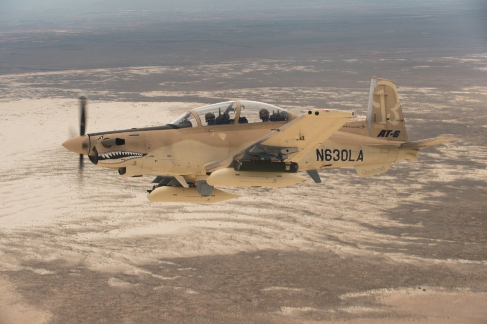 HOLLOMAN AIR FORCE BASE, N.M. (July 31, 2017) A Beechcraft AT-6 experimental aircraft flies over White Sands Missile Range. The AT-6 is participating in the U.S. Air Force Light Attack Experiment (OA-X), a series of trials to determine the feasibility of using light aircraft in attack roles. U.S. Air Force Photo by Ethan D. Wagner via DVIDS.