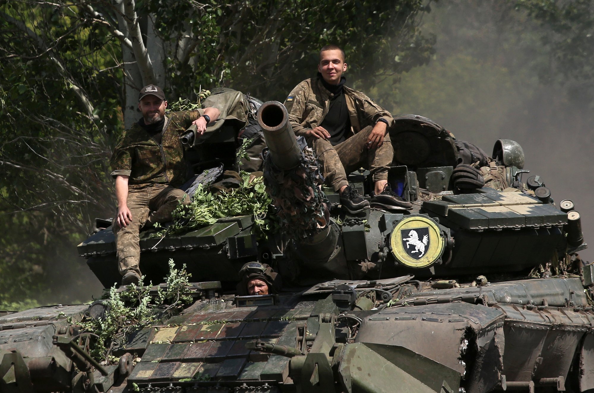 Ukrainian soldiers ride a tank on a road in the Donetsk region on July 20, 2022, near the front line between Russian and Ukrainian forces. Russia's top diplomat said Wednesday that Moscow's military aims in Ukraine were no longer focused "only" on the country's east, adding that supplies of Western weapons had changed the Kremlin's calculus. Photo by Anatolii Stepanov / AFP via Getty Images.
