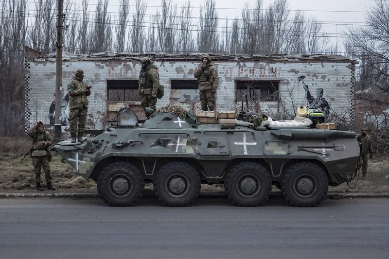 Ukrainian soldiers stand on an armored personnel carrier before going to the frontline in Donetsk region, Ukraine, Saturday, Jan. 28, 2023. (AP Photo/Andriy Dubchak)