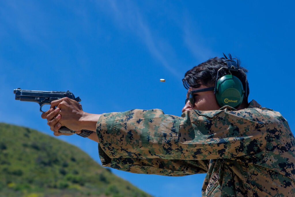 U.S. Marine Corps Cpl. Emanuel Luna, a military policeman with I Marine Expeditionary Force, fires his M9 pistol during a live fire range on Camp Pendleton, California, May 7, 2020. Photo by Cpl. Tia D. Carr/(U.S. Marine Corps, Released.