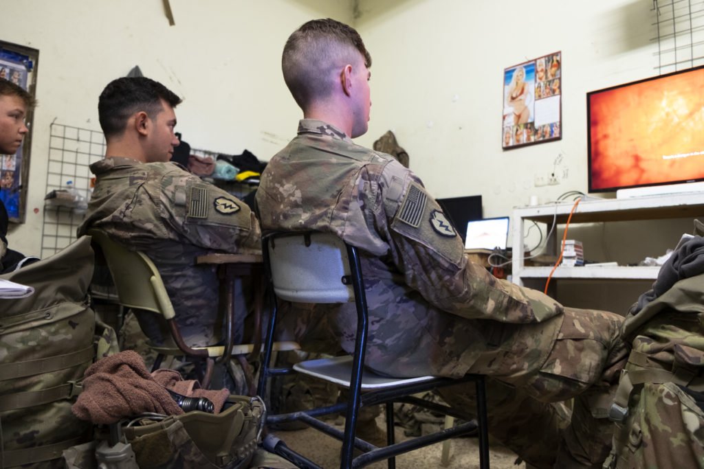 Cavalry Scouts from Apex Company watch a youtube playthrough of Resident Evil 7. Photo by Kevin Knodell/Coffee or Die.