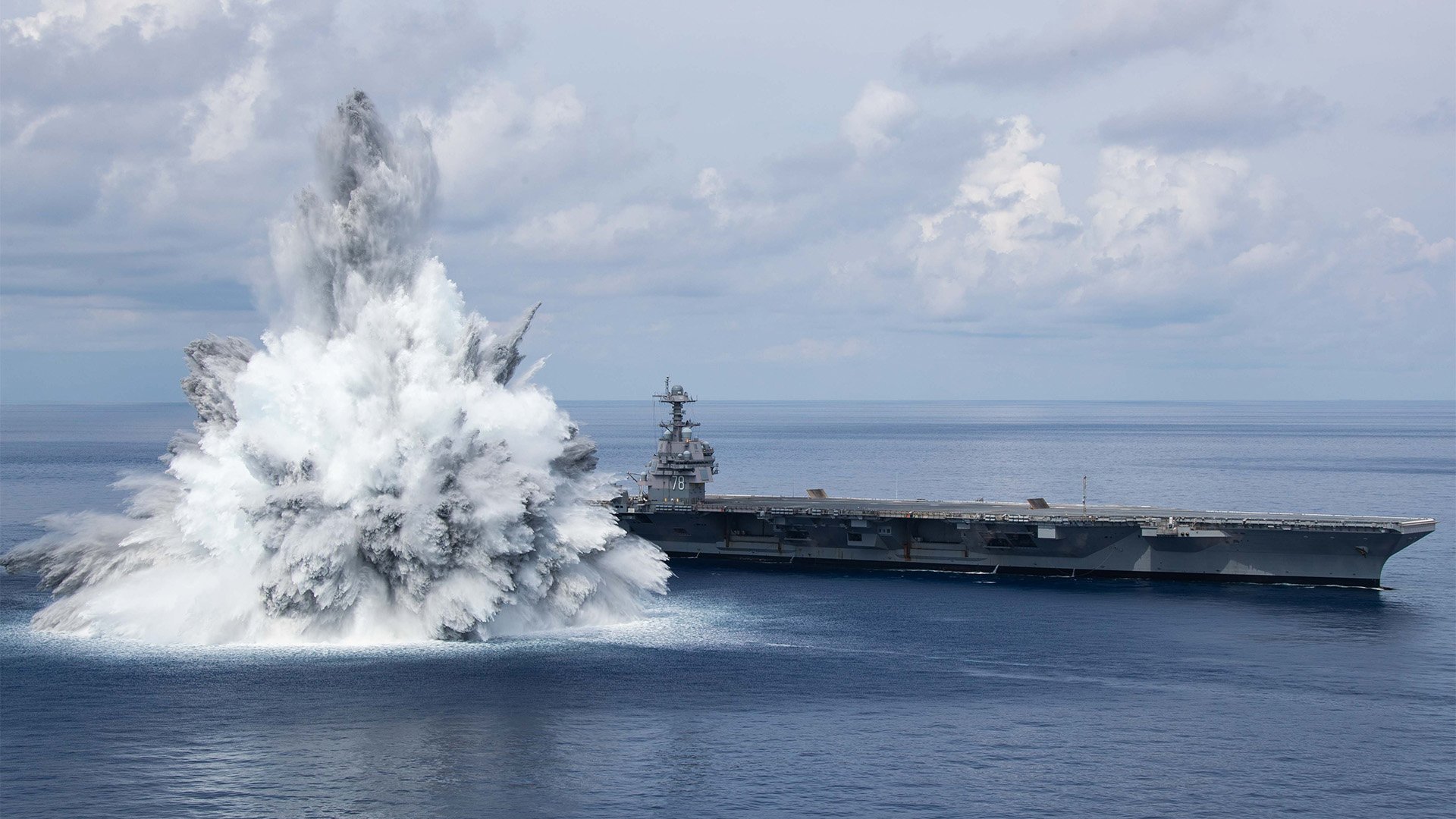 The aircraft carrier Gerald R. Ford (CVN 78) successfully completed the third and final scheduled explosive event for Full Ship Shock Trials while underway in the Atlantic Ocean, Aug. 8, 2021. Shock trials of new ship designs using live explosives confirm that US Navy warships will meet demanding mission requirements during battle. US Navy Photo by Mass Communication Specialist 3rd Class Jackson Adkins.