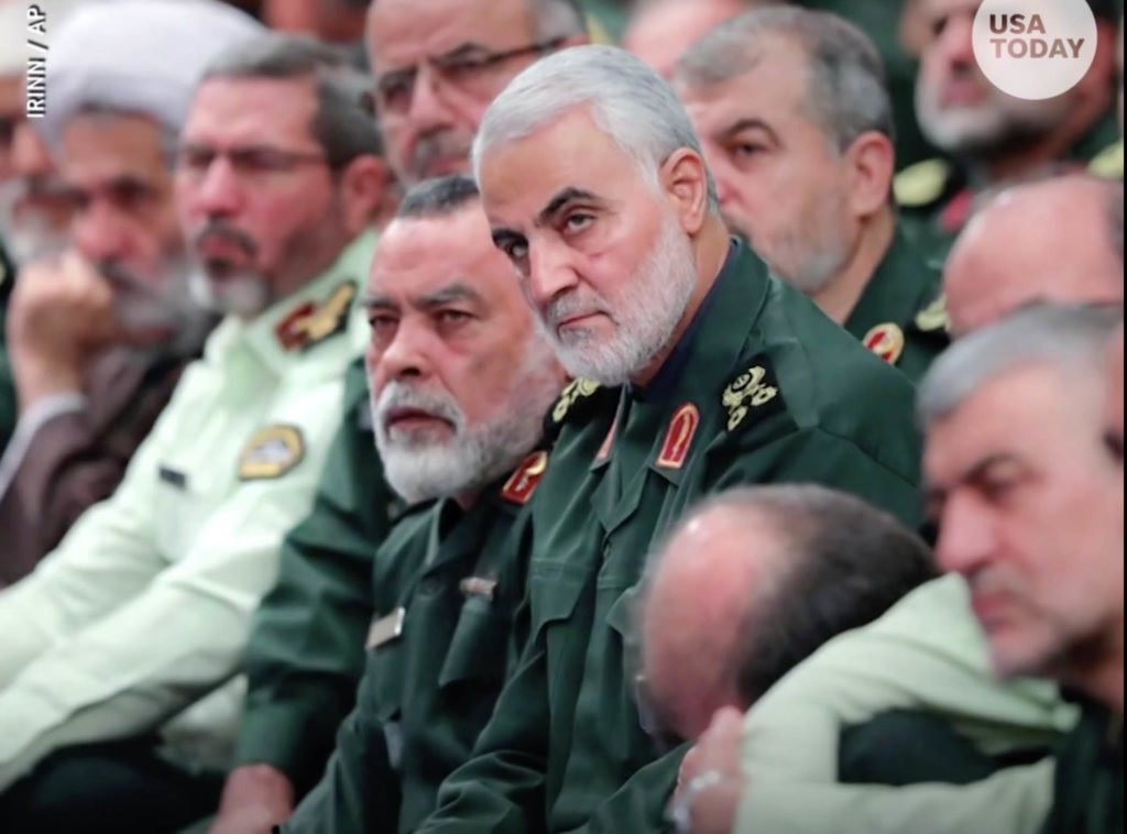 Gen. Qassem Soleimani, center, with a group of Iran Revolutionary Guard members in Tehran in October. Screen grab taken from "Fears of WWIII after U.S. air strike on Iran's Gen. Soleimani?" video uploaded by USA Today on Jan. 3, 2020.