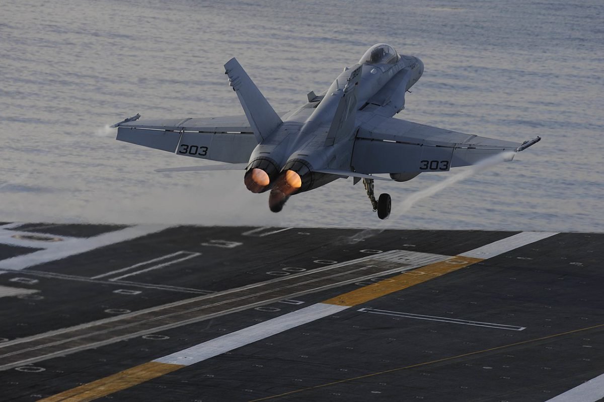 An F/A-18C Hornet from Strike Fighter Squadron (VFA) 146 performs a touch-and-go off the flight deck of the aircraft carrier USS Nimitz (CVN 68). US Navy photo by Mass Communication Specialist 3rd Class Ian A. Cotter.