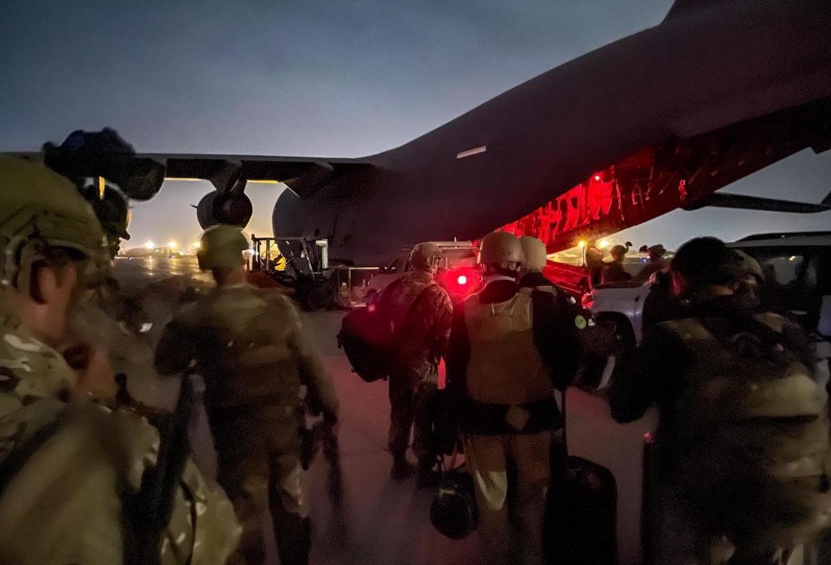 US troops prepare to board one of the final Air Force C-17s to depart Hamid Karzai International Airport Monday, Aug. 30, 2021. US Army photo by Master Sgt. Alexander Burnett.
