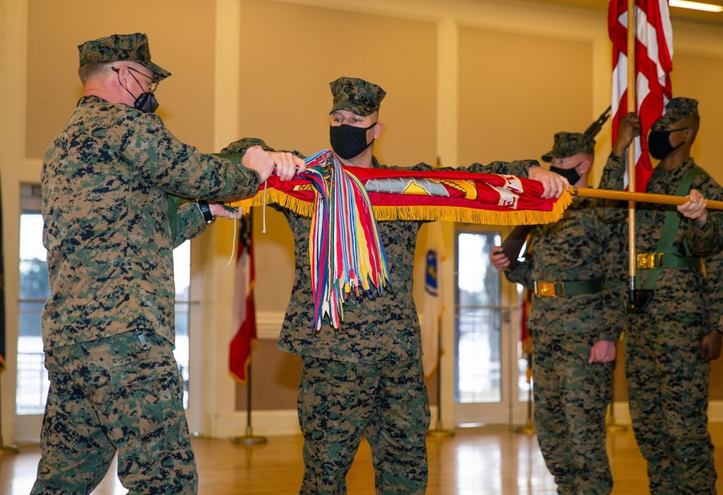 US Marine Corps Col. John H. Rochford, commanding officer of 8th Marine Regiment, and Sgt. Maj. Keith D. Hoge, case the regimental colors during a deactivation ceremony on Camp Lejeune, N.C., Jan. 28, 2021. The regiment served a total of 68 years and is now being deactivated in accordance with the Commandant of the Marine Corps’ Force Design 2030. US Marine Corps photo by Lance Cpl. Chase W. Drayer, courtesy of DVIDS.