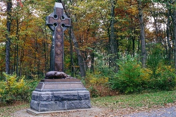 The bronze likeness of an Irish wolfhound representing loyalty lies atop the base of the monument at Gettysburg, Pa., which honors the New York regiments of the Irish Brigade who served in the Civil War. The monument is a green malachite Celtic cross with a trefoil, an Irish harp and the numbers of the three New York regiments rendered in bronze on its front. Photo courtesy of the National Parks Service.