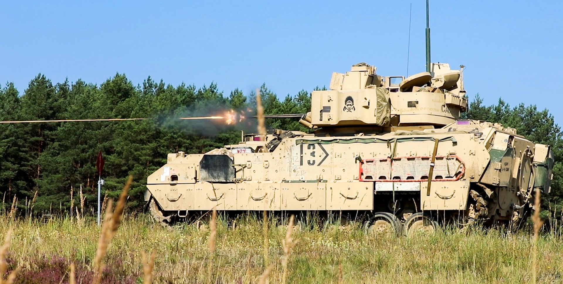 An M2 Bradley fighting vehicle with the 3rd Armored Brigade Combat Team, 1st Cavalry Division fires on a range in Poland. President Joe Biden said the US may soon send the heavily armored troops carriers to Ukraine. Bradley's would be the heaviest ground combat equipment supplied to Ukraine by the US. Photo by Staff Sgt. Charles Porter.