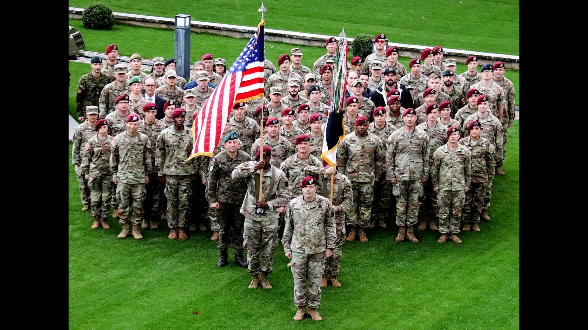 The 18th Airborne Corps staff, led by Lt. Gen. Christopher Donahue and Command Sgt. Maj. T.J. Holland, gather in front of the Joint Task Force - Dragon Headquarters in Wiesbaden, Germany, on Oct. 21, 2022, to commemorate the completion of the command's nine-month deployment to Europe. US Army photo by Lt. Col. David Olson.