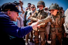 A U.S. veteran shakes hands with a World War II enthusiasts during a gathering in preparation of the 79th D-Day anniversary in Sainte-Mere-Eglise, Normandy, France, Sunday, June 4, 2023. The landings on the coast of Normandy 79 year ago by U.S. and British troops took place on June 6, 1944. AP photo by Thomas Padilla.