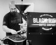 Matt Leviner roast profiling on BRCC’s 1kg Probat coffee roaster in the San Antonio coffee lab 2019. Photo by The Veterans Project, courtesy of Matt Leviner.