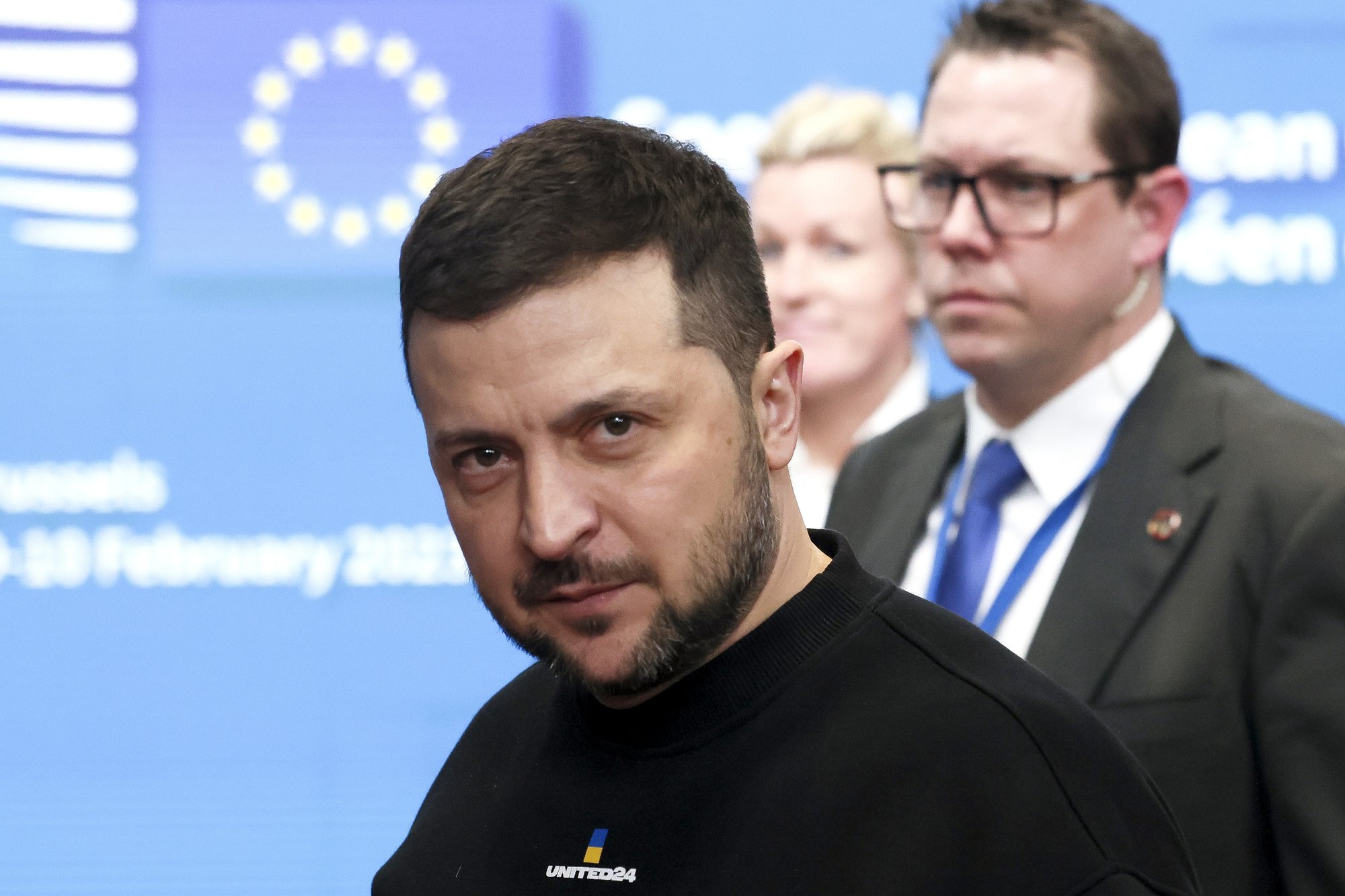 Ukraine's President Volodymyr Zelenskyy, left, leaves after meeting European Union leaders at an EU summit in Brussels on Thursday, Feb. 9, 2023. European Union leaders are meeting for an EU summit on Thursday to discuss Ukraine and migration. (Yves Herman, Pool Photo via AP)
