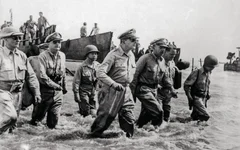 Gen. Douglas MacArthur wades ashore at the Philippine island of Leyte on Oct. 20, 1944. US Army photo.