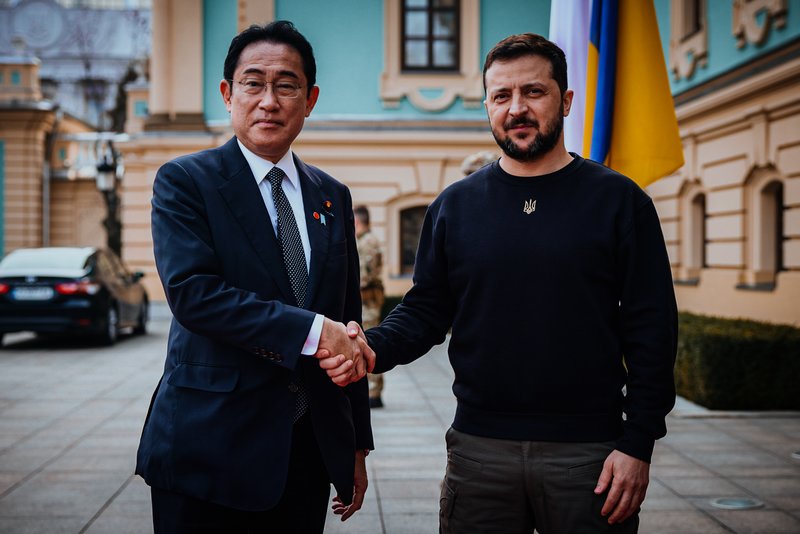 Japanese Prime Minister Fumio Kishida and Ukrainian President Volodymyr Zelenskyy, right, greet each other during their meeting in Kyiv, Ukraine, Tuesday, March 21, 2023. (Ukrainian Presidential Press Office via AP)