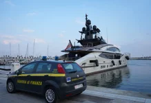 An Italian Finance Police car is parked in front of the yacht “Lady M”, owned by Russian oligarch Alexei Mordashov, docked at Imperia’s harbor, on March 5, 2022. Photo by Andrea Bernardi/ AFP via Getty Images